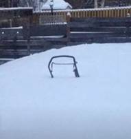 A metal frame in the snow

AI-generated content may be incorrect.