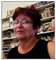 A person holding a book shelf

Description automatically generated
