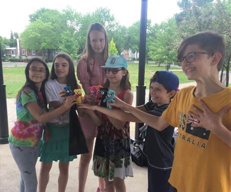 A group of people posing for the camera

Description automatically generated