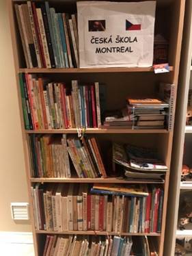 A picture containing text, shelf, book, indoor
Description automatically generated