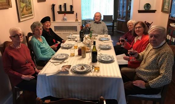 A group of people sitting around a table

Description automatically generated with medium confidence