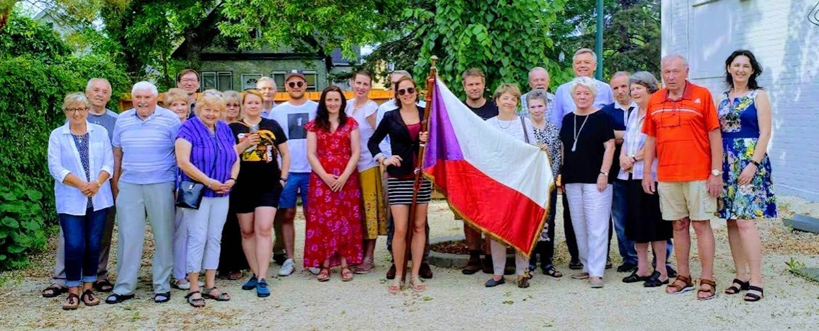 A group of people posing for a photo
Description automatically generated