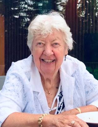A person smiling at the camera

Description automatically generated