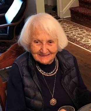 An old person smiling at camera

Description automatically generated
