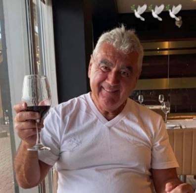 A person holding a wine glass

Description automatically generated
