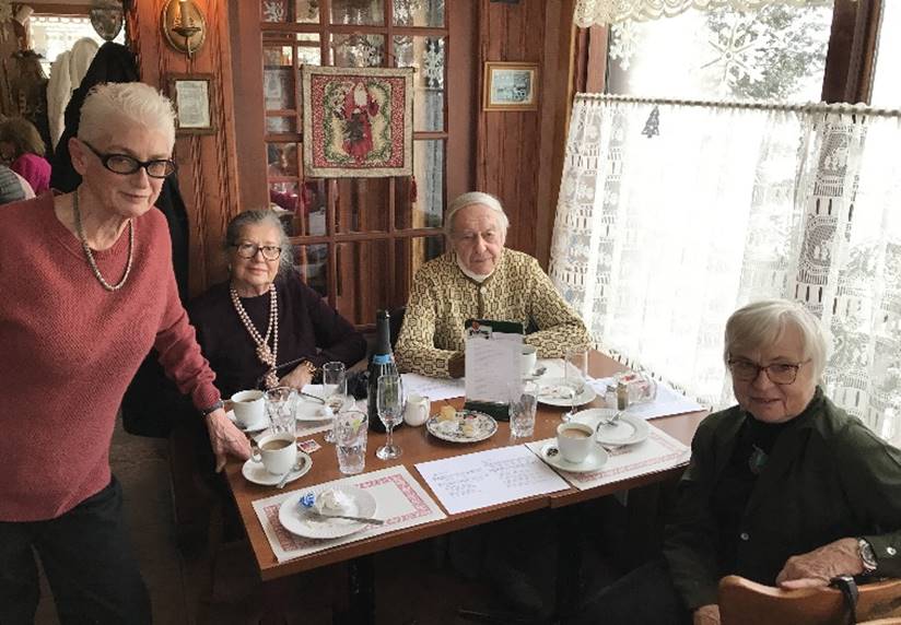 A group of people sitting at a table

Description automatically generated