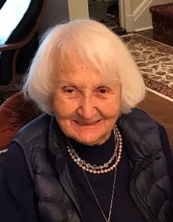 An old person smiling for the camera

Description automatically generated