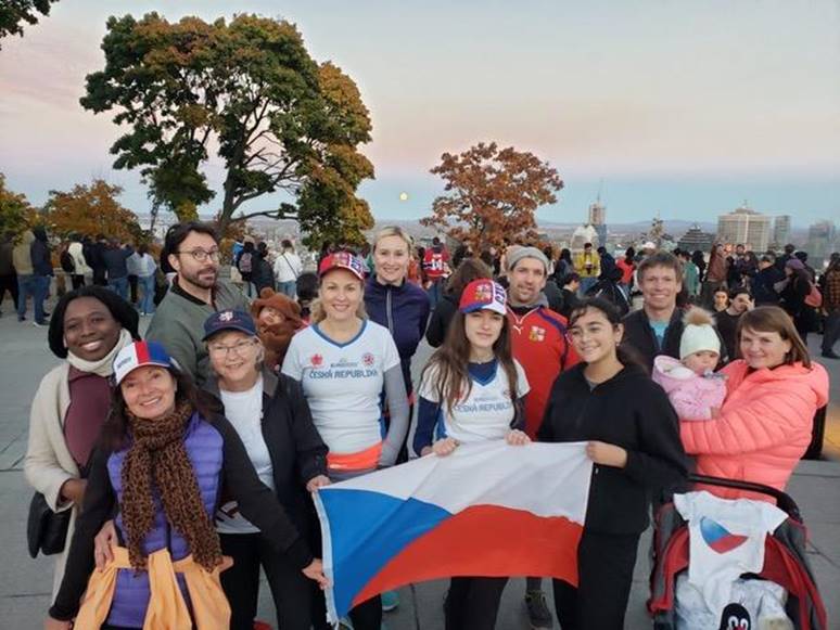 A group of people posing for a photo
Description automatically generated