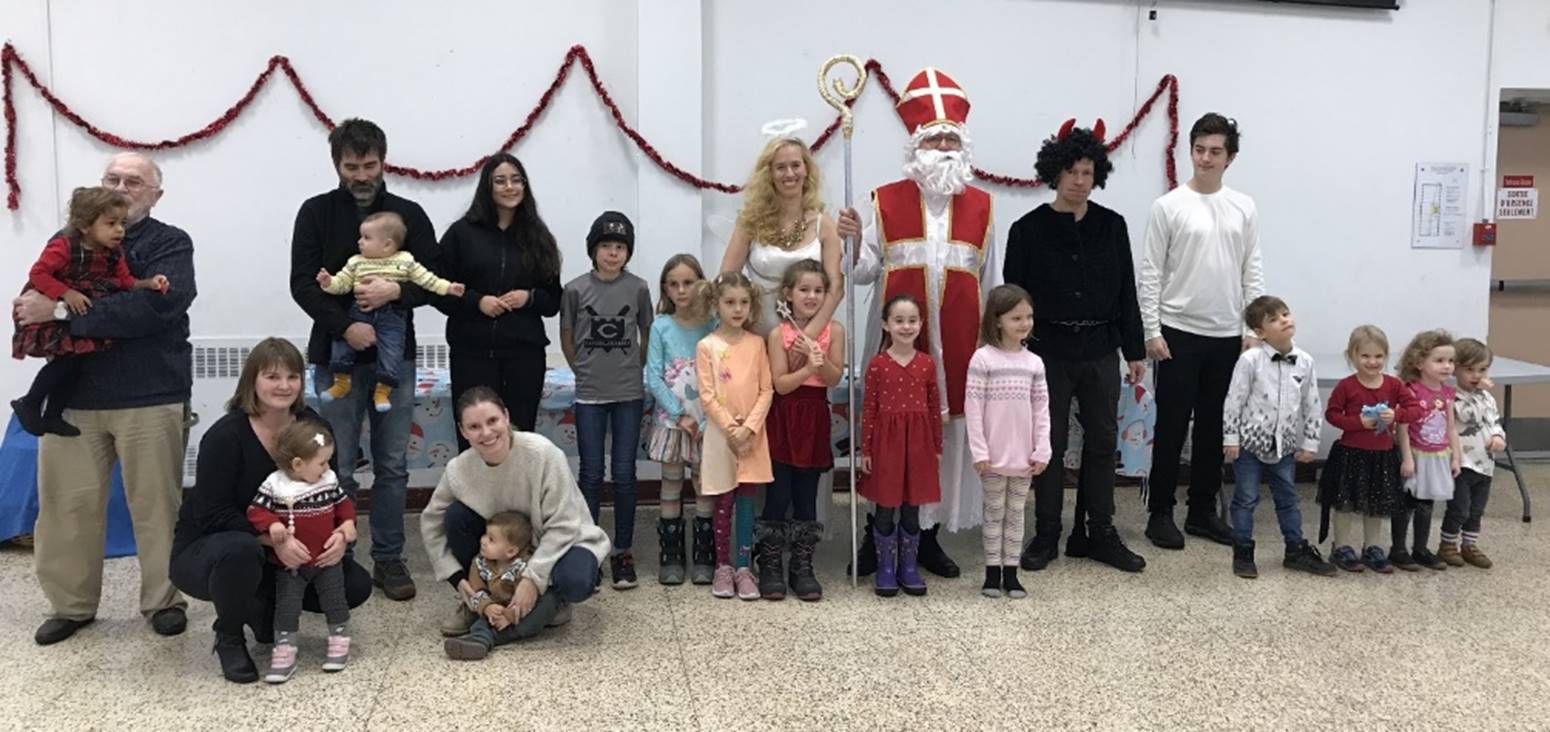 A group of people posing for a photo
Description automatically generated