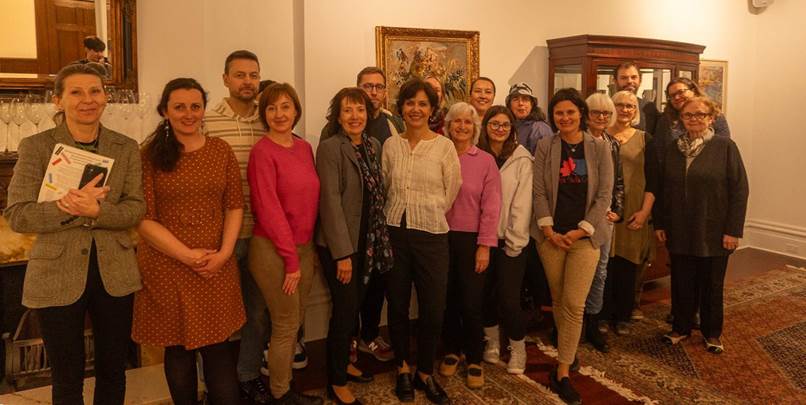 A group of people posing for a photo
Description automatically generated