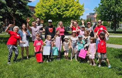 A group of people posing for a photo

Description automatically generated