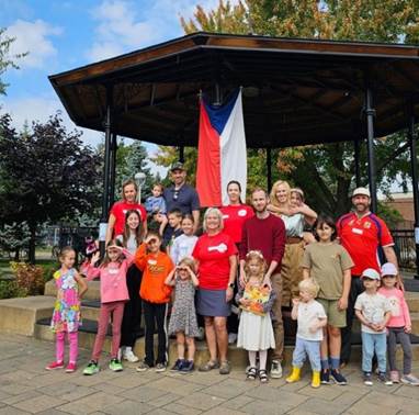 A group of people posing for a photo

Description automatically generated